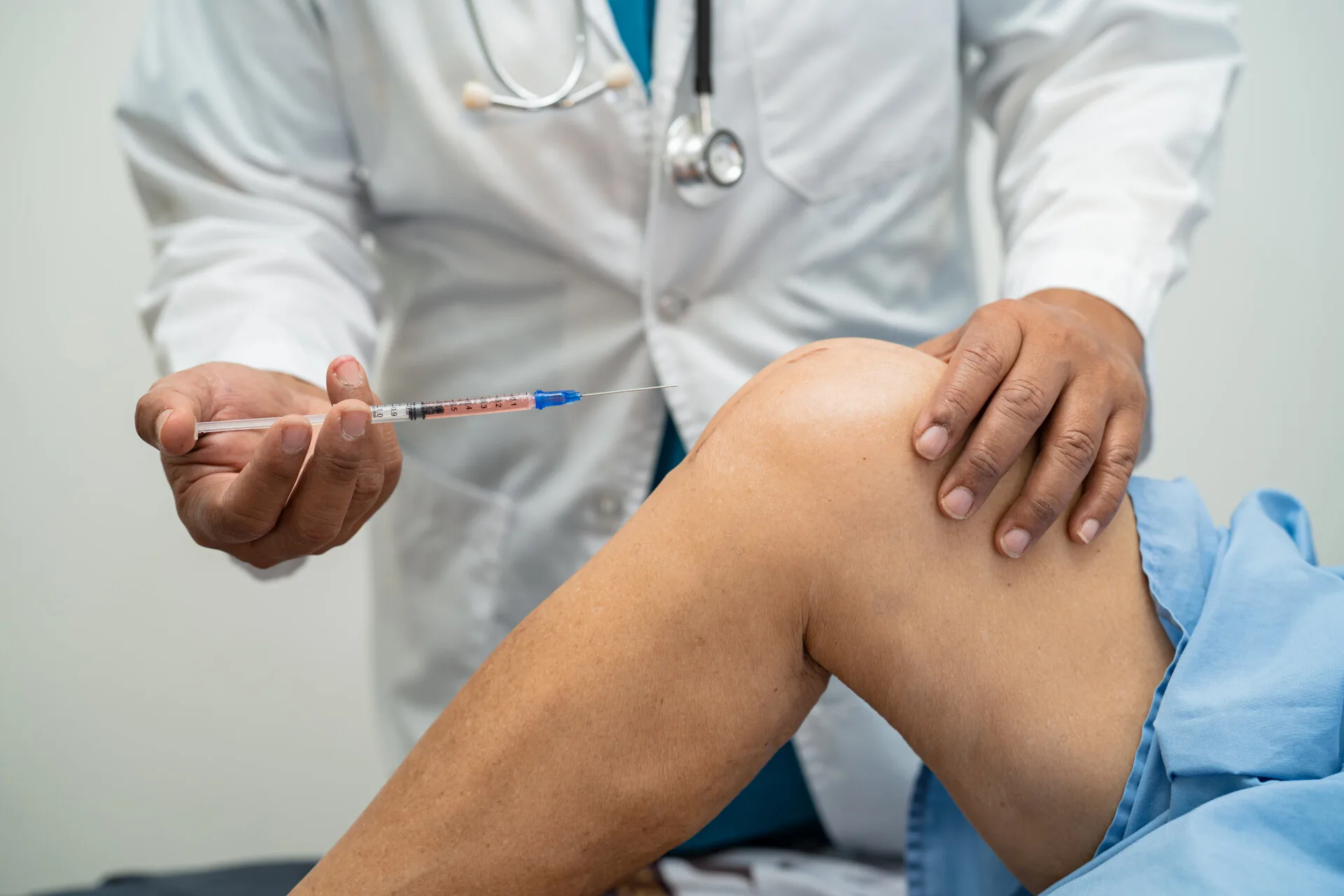 asian-doctor-inject-hyaluronic-acid-platelet-rich-plasma-into-knee-senior-woman-walk-without-pain