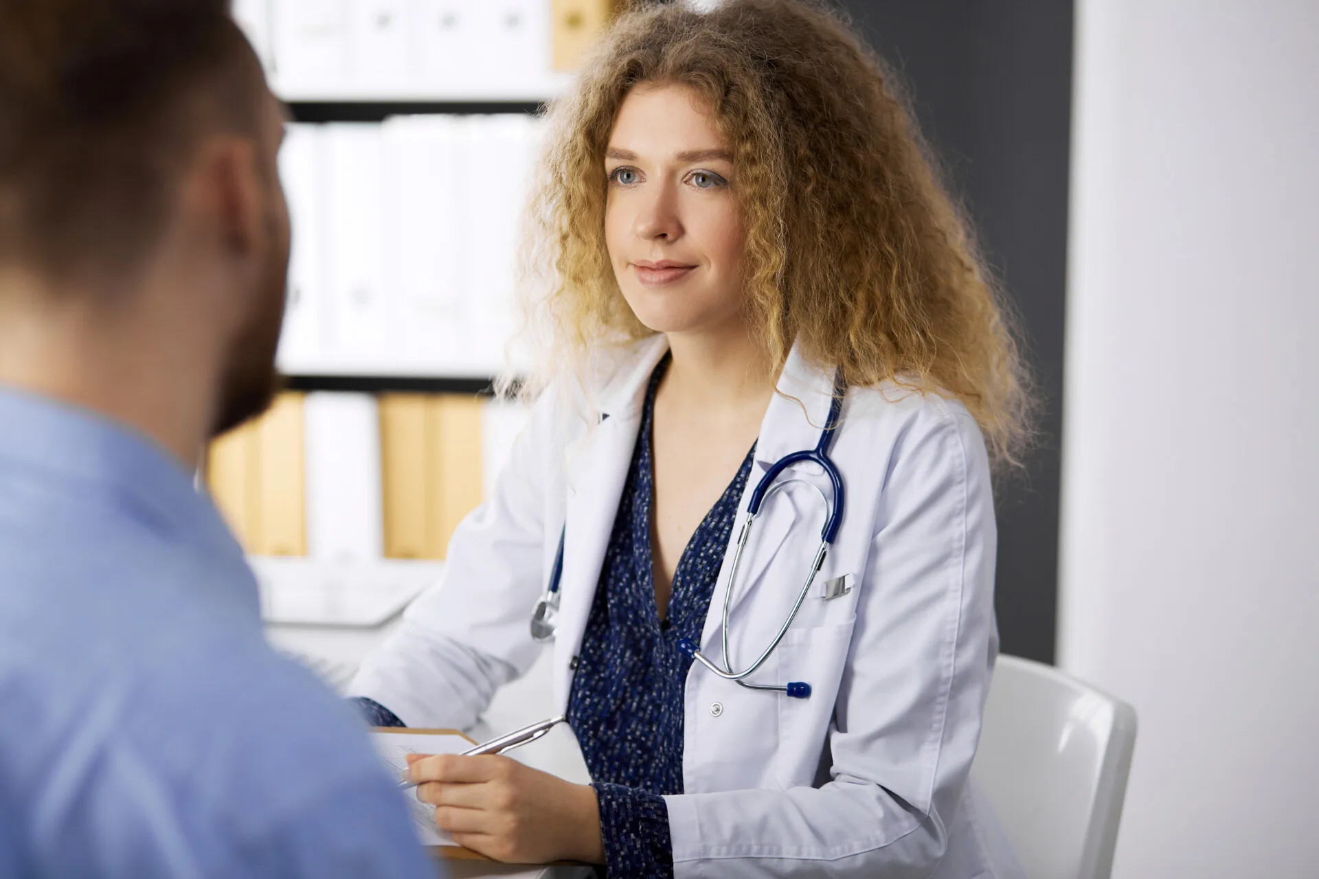 female-doctor-man-patient-discussing-current-health-examination-while-sitting-clinic-perfect-medical-service-medicine-concept (1)